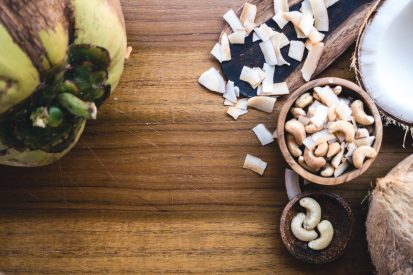 cashew-nuts-and-coconut-on-a-wooden-table.jpg