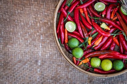 chili-peppers-and-limes-on-a-wooden-table.jpg